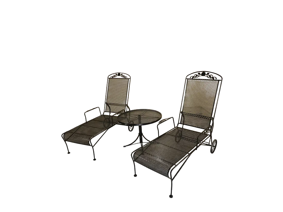 Pair of black Russell Woodard wrought iron chaise lounges with rose crests and adjustable backs